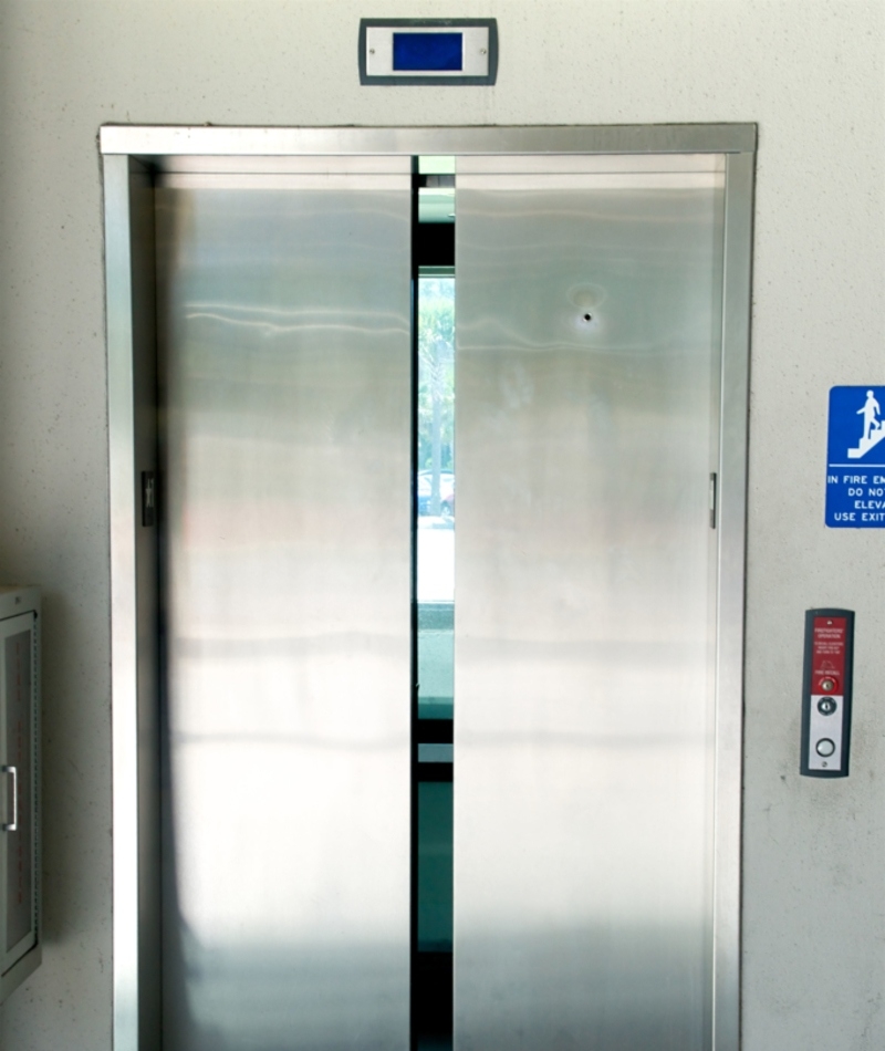 Hole in the Elevator Doors | Alamy Stock Photo