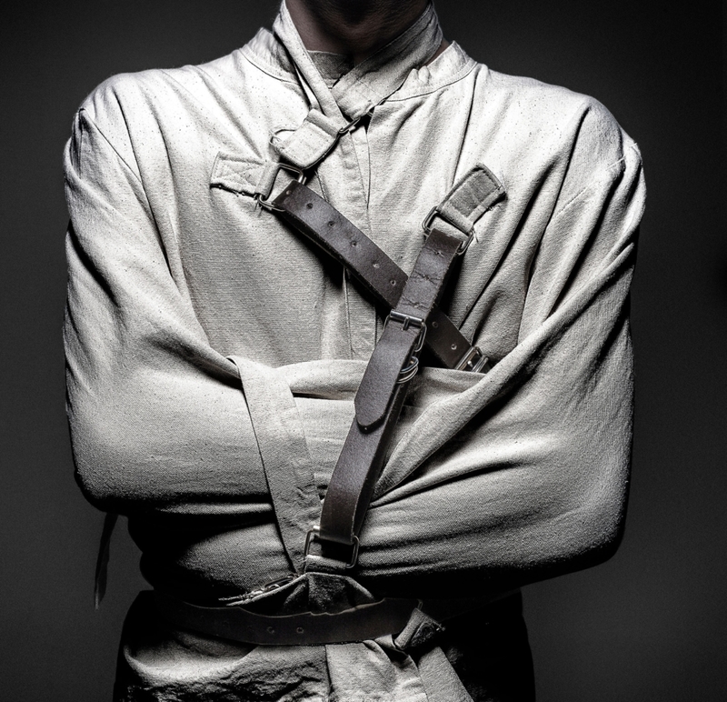 Secret Behind the Straight Jacket Escape | Alamy Stock Photo by AGB Photo Library 