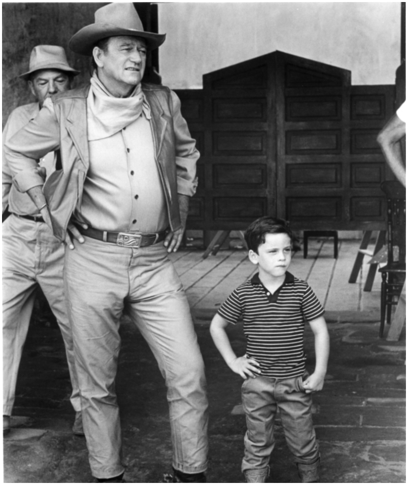 John Wayne and His Son Posing on the set of The War Wagon, 1967 | Alamy Stock Photo by Marvin Schwartz Productions/Universal Pictures/Masheter Movie Archive