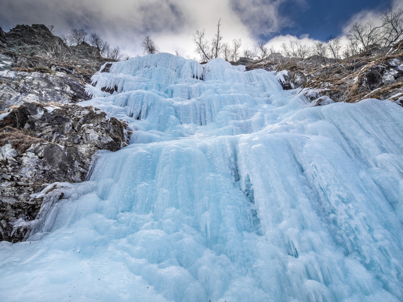 Scale a Frozen Waterfall | Shutterstock