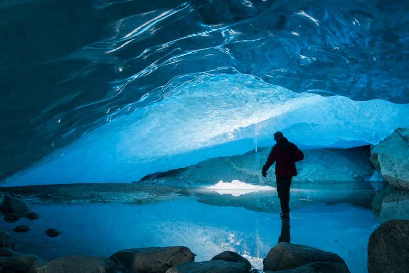 Visit an Ice Cave in a Glacier | Getty Images Photo by wanderluster