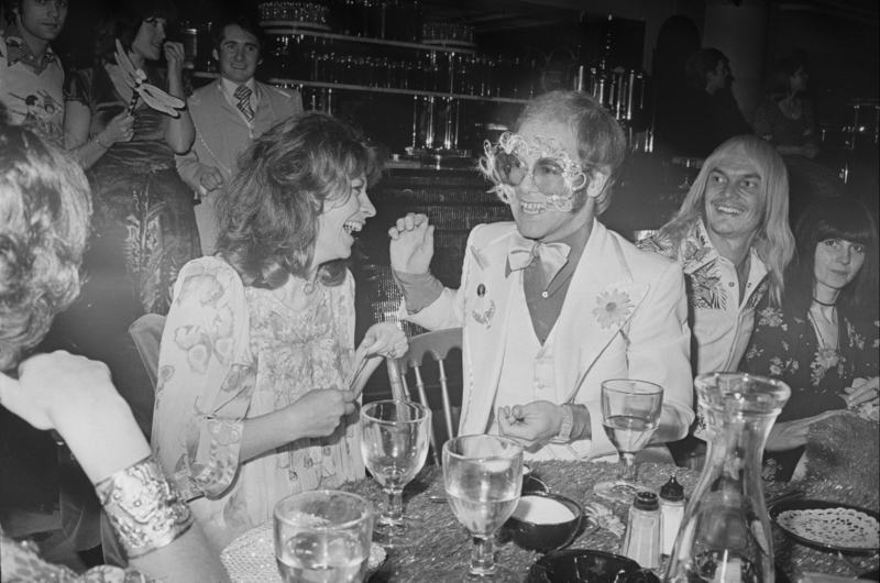 Elton John Amuses Party Guests | Getty Images Photo by David Cairns/Daily Express/Hulton Archive