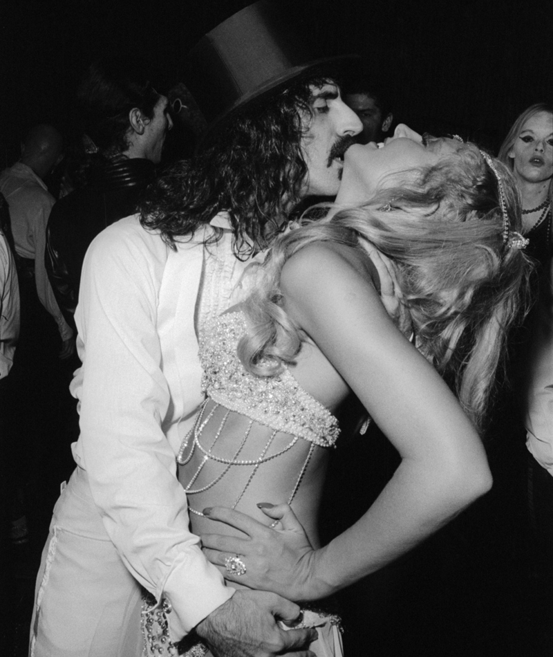 Frank Zappa Celebrates with a Showgirl | Getty Images Photo by Allan Tannenbaum